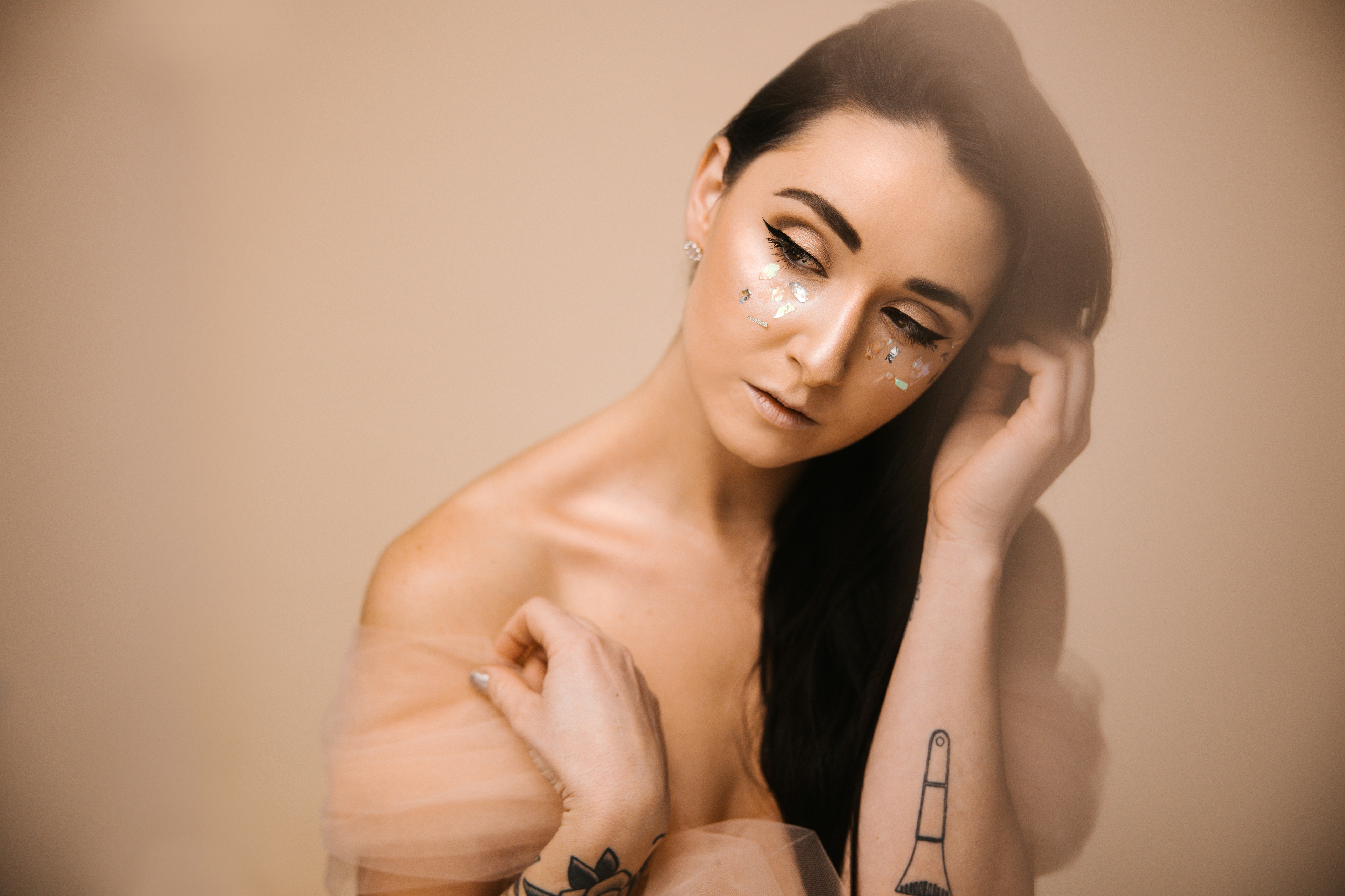 a woman with a tattoo on her arm